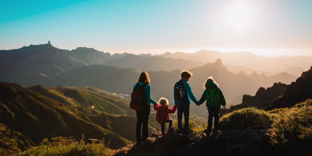 A family enjoying the view high up on their mountain hike